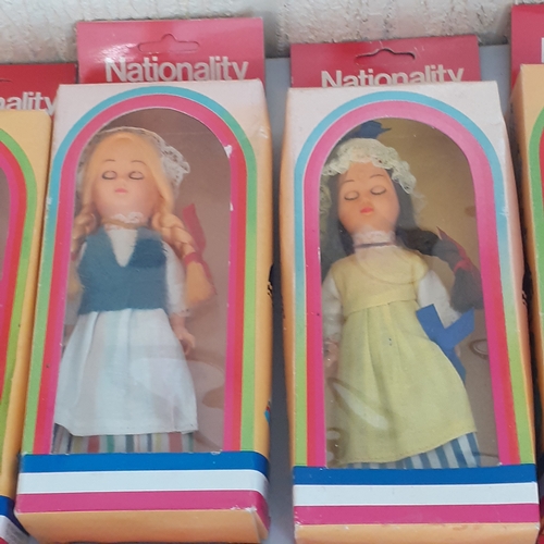 8 - Quantity of full set of 12 nationality costume dolls with sleeping eyes. Dolls never been out of box... 