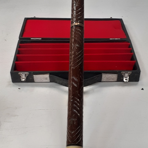 16 - Pool cue in case. Nice carved wooden handle, brass trimmings. Approx 58