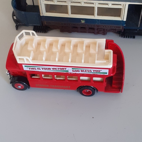 18 - A matchbox diecast city life bus, with a selection of other buses and trams. Boxed item has never be... 