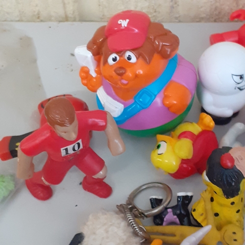 19 - Large quantity of small toys. Includes Smurf, Batman, spacemen, small animals, some wind up toys and... 