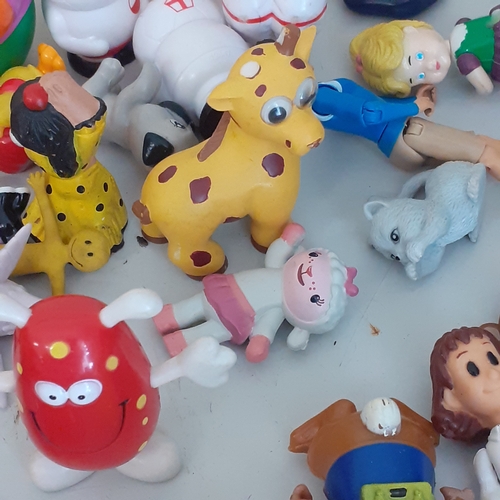 19 - Large quantity of small toys. Includes Smurf, Batman, spacemen, small animals, some wind up toys and... 