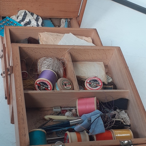 24 - Cantilever sewing box and contents. Floor standing, good condition but one small stud missing