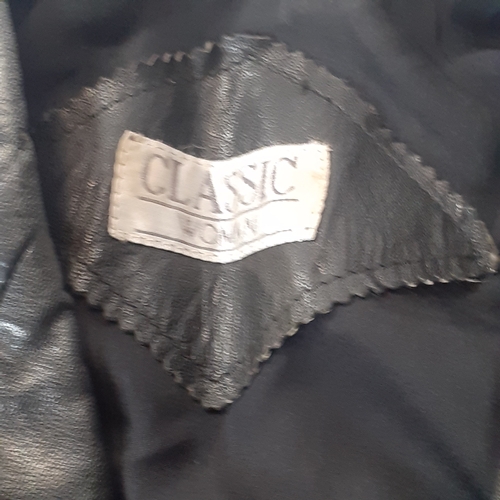 33 - Womans classic leather jacket. No size found. Looks med-large. Good condition, may have had a pin ba... 