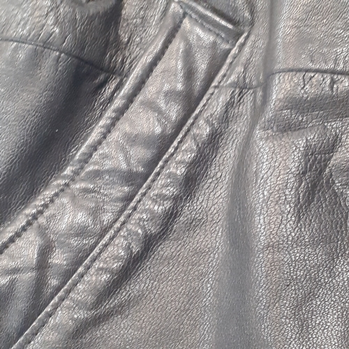 33 - Womans classic leather jacket. No size found. Looks med-large. Good condition, may have had a pin ba... 