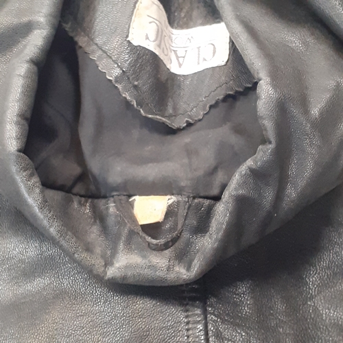 33 - Womans classic leather jacket. No size found. Looks med-large. Good condition, may have had a pin ba... 