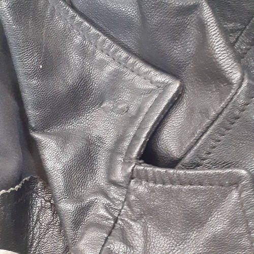 33 - Womans classic leather jacket. No size found. Looks med-large. Good condition, may have had a pin ba... 