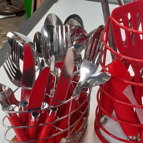 42 - Red kitchenware. Grill, toaster, utensils and cutlery, tea, coffee, sugar, biscuit cannisters,  crue... 