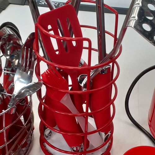 42 - Red kitchenware. Grill, toaster, utensils and cutlery, tea, coffee, sugar, biscuit cannisters,  crue... 