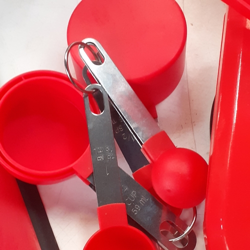 42 - Red kitchenware. Grill, toaster, utensils and cutlery, tea, coffee, sugar, biscuit cannisters,  crue... 