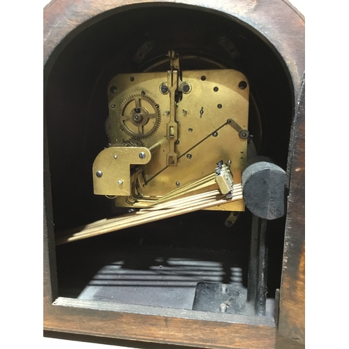 125 - Domed, wooden mantle clock. No glass, no key.