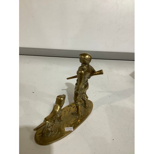 93 - Heavy brass man & dog ornament