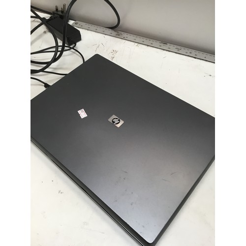 218 - Retro HP 510 laptop with charger no hard drive