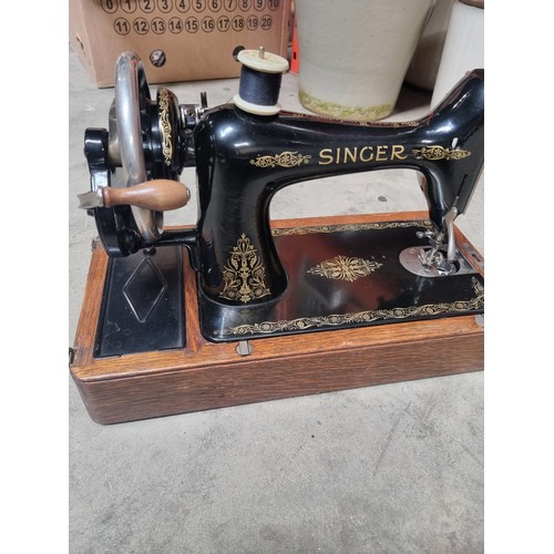 120 - Vintage singer sewing machine in case with key