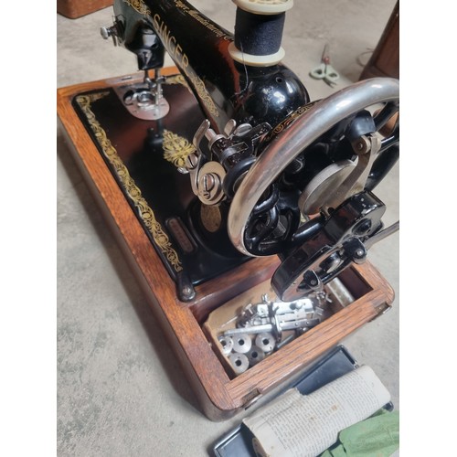 120 - Vintage singer sewing machine in case with key