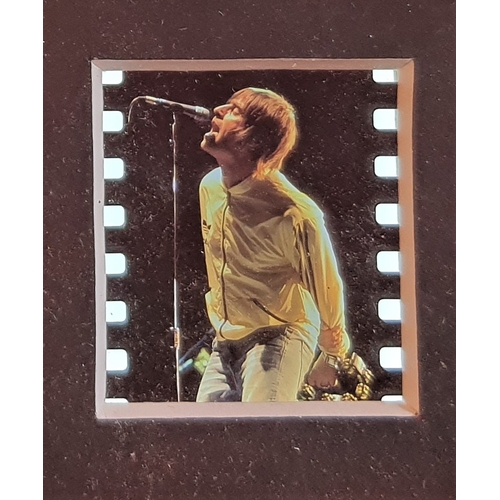 106A - Original film cell of Liam Gallagher, Oasis, on stage. Framed and glazed limited edition presentatio... 