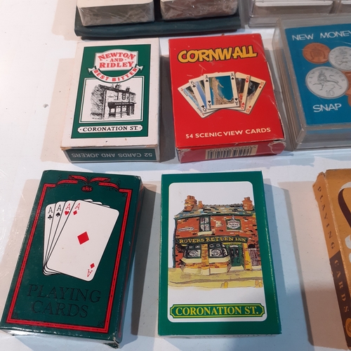 11 - Multiple decks of playing cards.  Some new, still wrapped and some vintage. Include, Guinness,  Coro... 