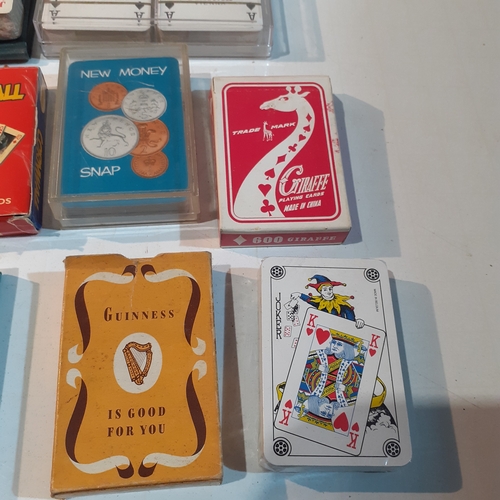 11 - Multiple decks of playing cards.  Some new, still wrapped and some vintage. Include, Guinness,  Coro... 