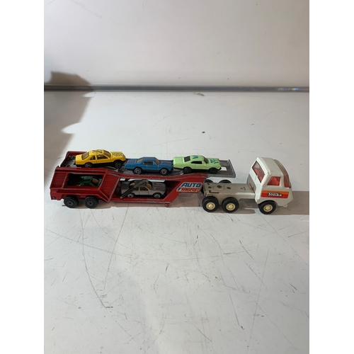 62 - Tonka transporter vehicle with mini cars