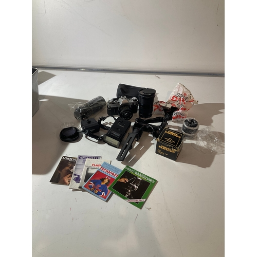 121 - Canon AE-1 camera with various lens and other accessories. Includes Canon Hoya 72mm lens, a Tamron t... 