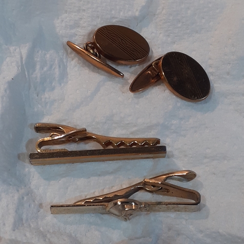 2 - A large number of cufflinks, some with matching tie pins. A pair of dartboard design with a dart tie... 
