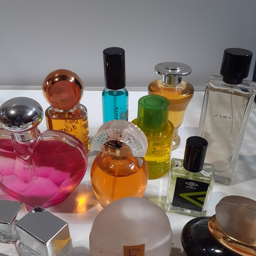 37 - 20 bottles of various perfumes and sprays. Mostly look unused. One or two, small amount missing