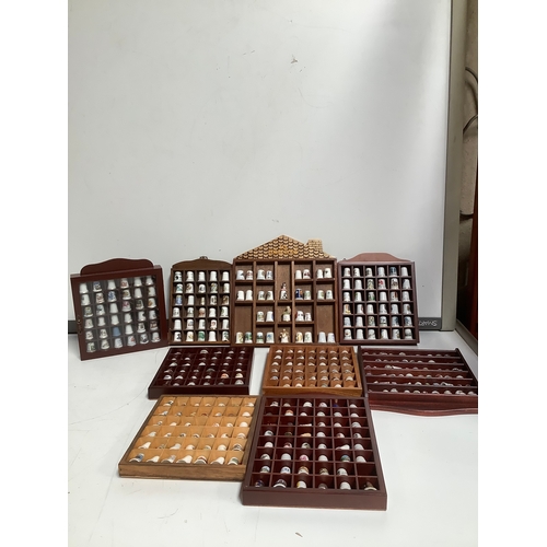 300 - 9 wooden display cases with collectable thimbles