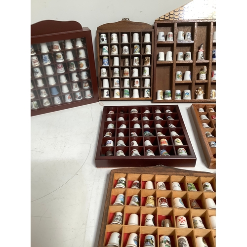 300 - 9 wooden display cases with collectable thimbles