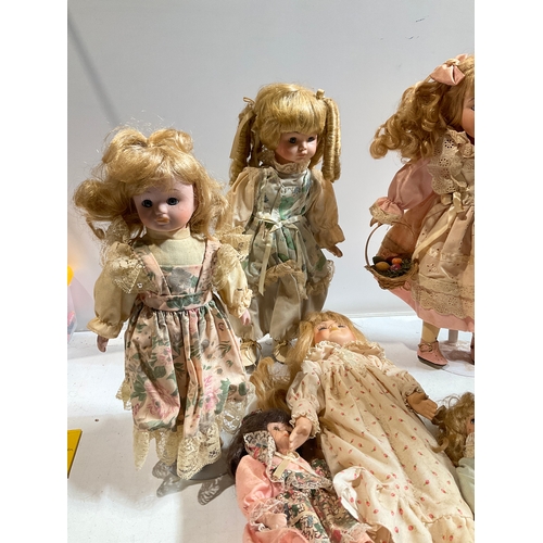 8 - Quantity of porcelain dolls. No damage, but dusty and would benefit from a clean.