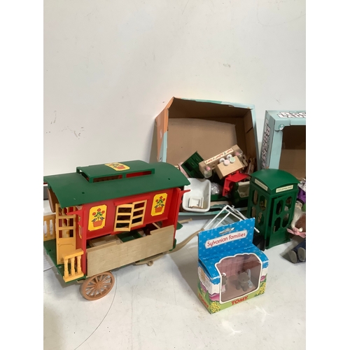 406 - Collection of Tomy Sylvanian families includes caravan house and figures