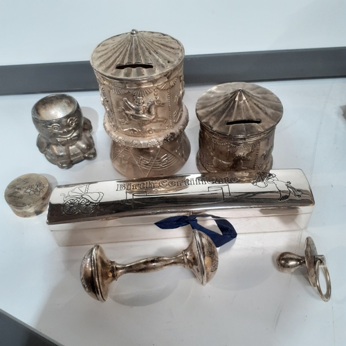 48 - Silver plate christening lot to include a musical and non musical money box, dummy, my first tooth t... 