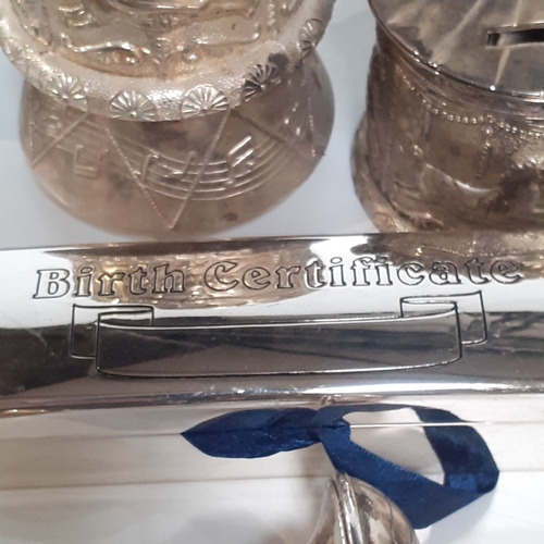 48 - Silver plate christening lot to include a musical and non musical money box, dummy, my first tooth t... 