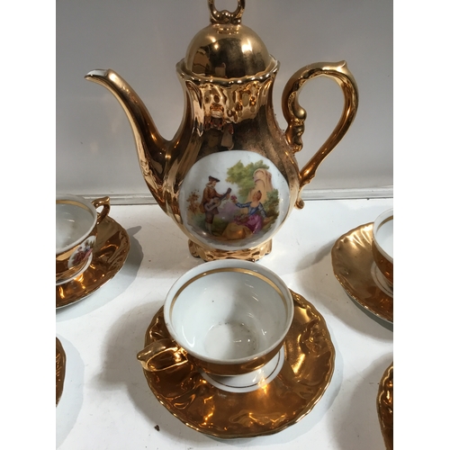 14 - Set of 3 gold coloured coffee set, milk jug, sugar pot etc