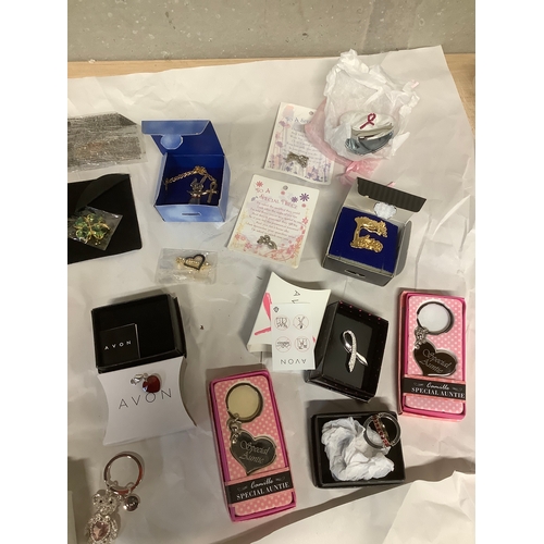 90A - Large collection of Avon jewellery special niece,auntie and keyrings brooches etc