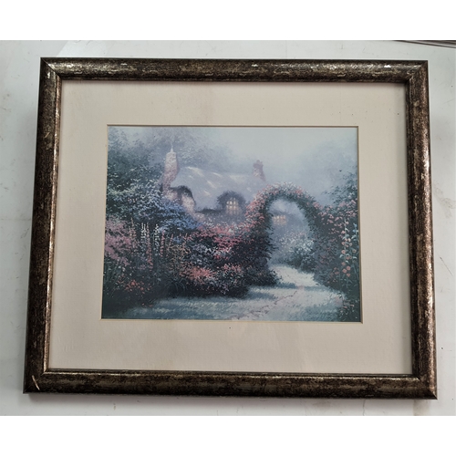 117A - Framed and glazed Thomas Kincade print of cottage with a floral archway in double mount. Size: 39 cm... 