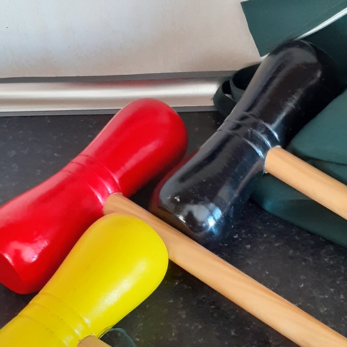 19 - Wooden croquet set. Colourfully painted in good condition. With carry bag and instructions