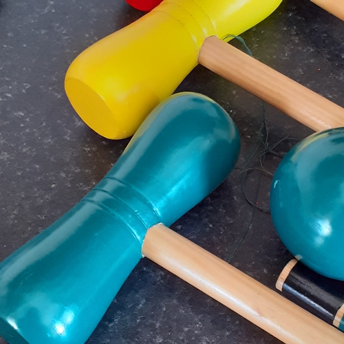 19 - Wooden croquet set. Colourfully painted in good condition. With carry bag and instructions