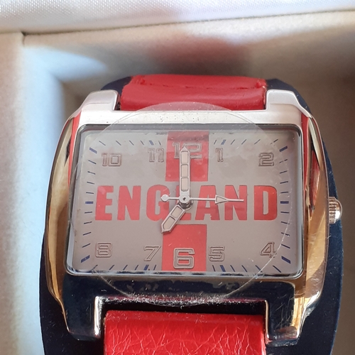 13 - England International watch. Still has protective film on. Like new in box. Requires battery.