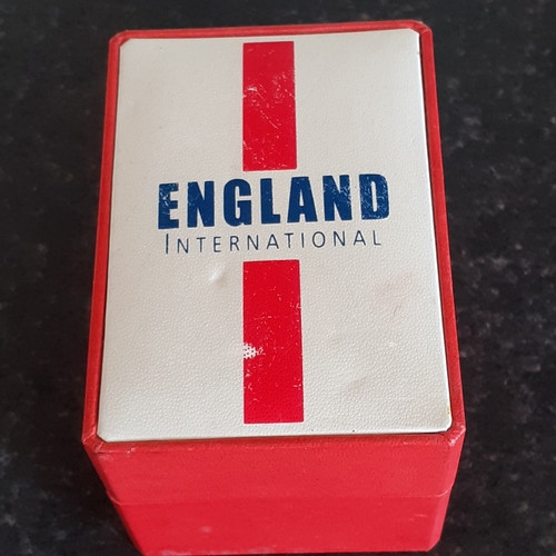 13 - England International watch. Still has protective film on. Like new in box. Requires battery.