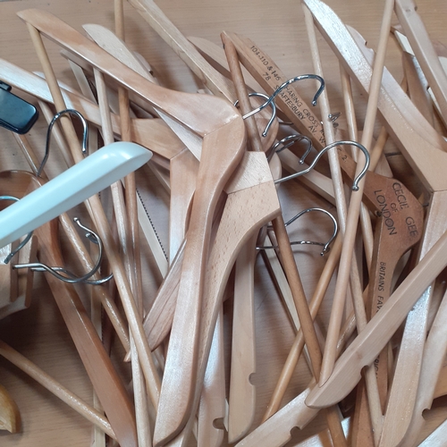 27 - A large number of mixed coathangers. Different styles. Lots of wooden trouser/suit hangers which are... 