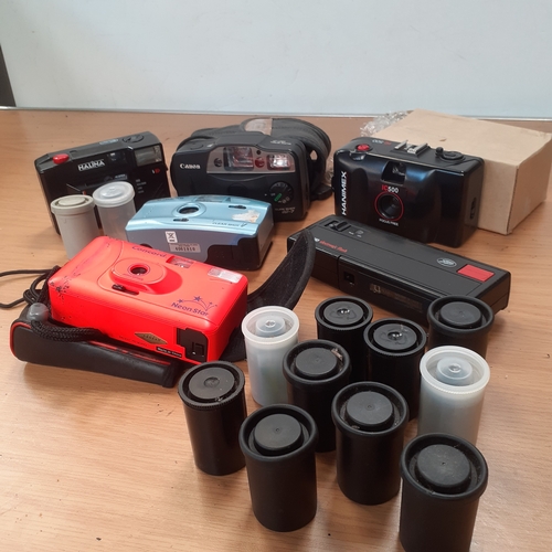 10 - A quantity of film cameras with 12 film pods, x10 containing films, 2 empty. Includes Canon, Hanimex... 