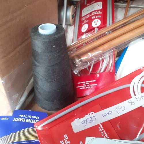 28 - Sewing/knitting lot. Knitting needles, lots of cotton reels, other vintage knitting items and more