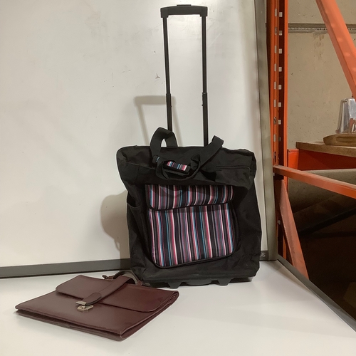 295 - Wheeled shopping bag plus brown briefcase