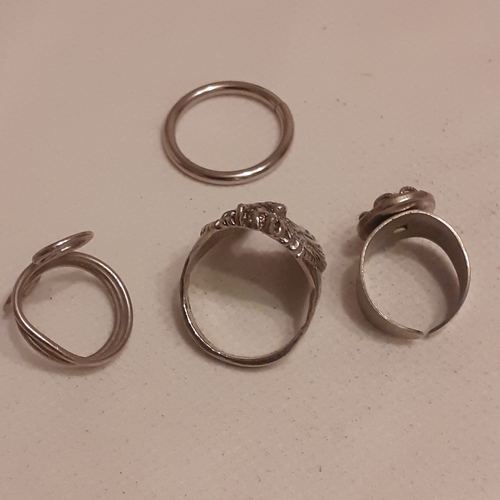 22 - A collection of silver coloured rings with some gothic style designs and some with various stones