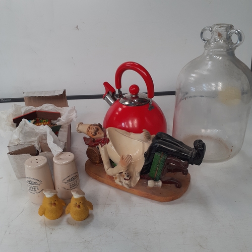 21 - A small vintage kitchen related lot. Includes a chef wine bottle holder, salt and pepper cruet, a me... 