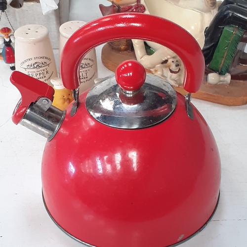 21 - A small vintage kitchen related lot. Includes a chef wine bottle holder, salt and pepper cruet, a me... 