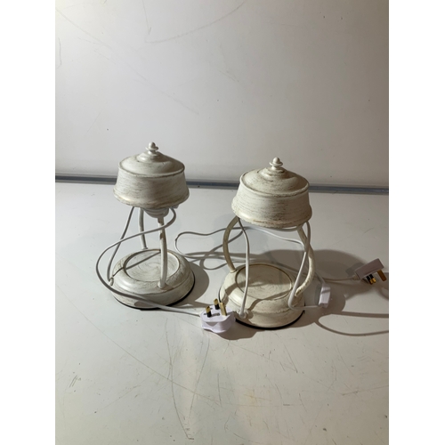 147 - A pair of white metal lantern style table lamps