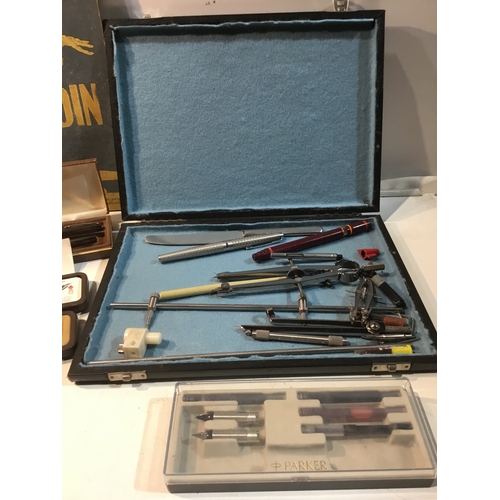 298 - Case of compasses & pens as well Parker & other pens and a vintage Aladdin book