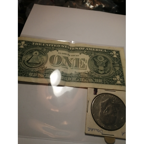 28A - USA dollar coin and a dollar note