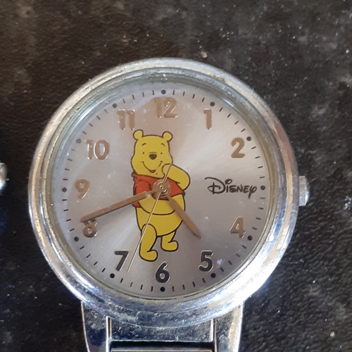 94 - 2 nurses style fob watches. A Quartz Constant and a Winnie the Pooh. Good condition but require batt... 