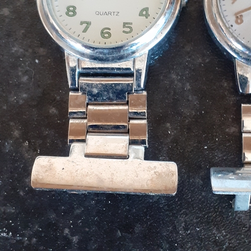 94 - 2 nurses style fob watches. A Quartz Constant and a Winnie the Pooh. Good condition but require batt... 